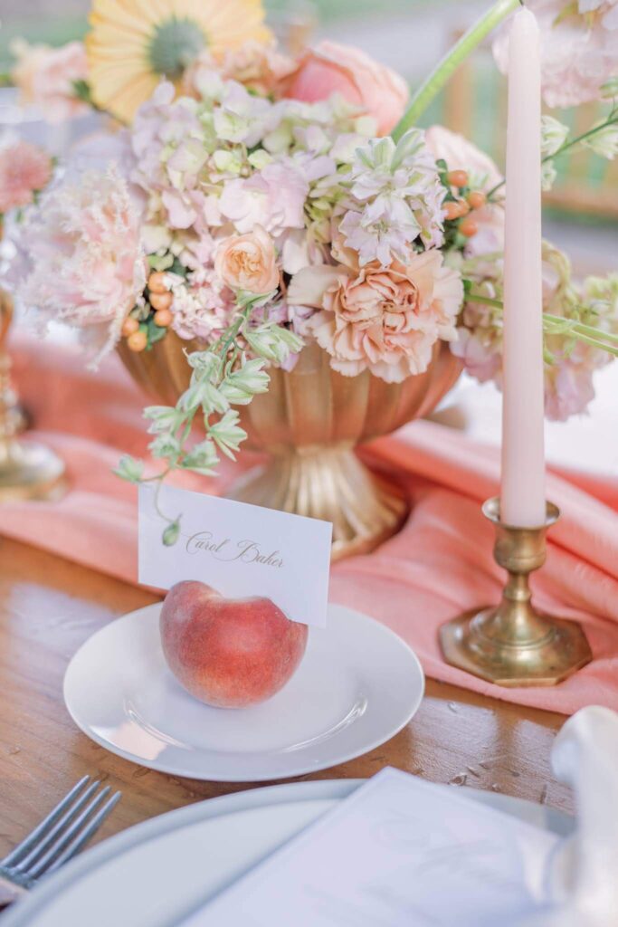 Place card in peach at outdoor wedding reception