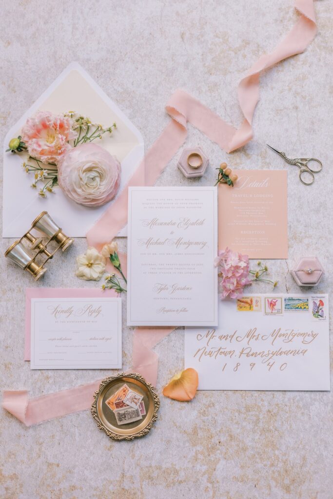 Full custom wedding invitation suite for Tyler Gardens romantic and timeless summer wedding. Features white details, peach fuzz details card, and gold accents.