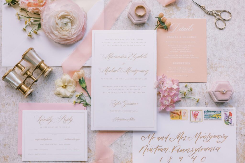 Custom timeless and romantic wedding invitation suite that features peach fuzz, white, and gold details