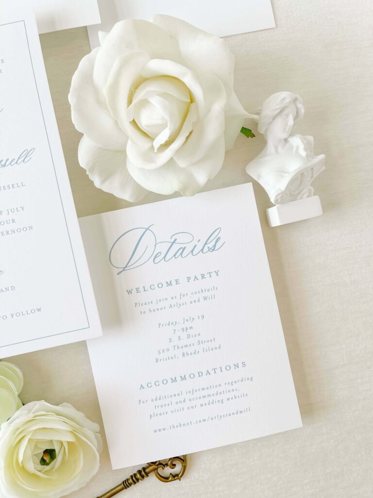 Closeup of details card with light blue font for a Linden Place, Bristol, Rhode Island wedding. Stationery designed by Heather Paperie.