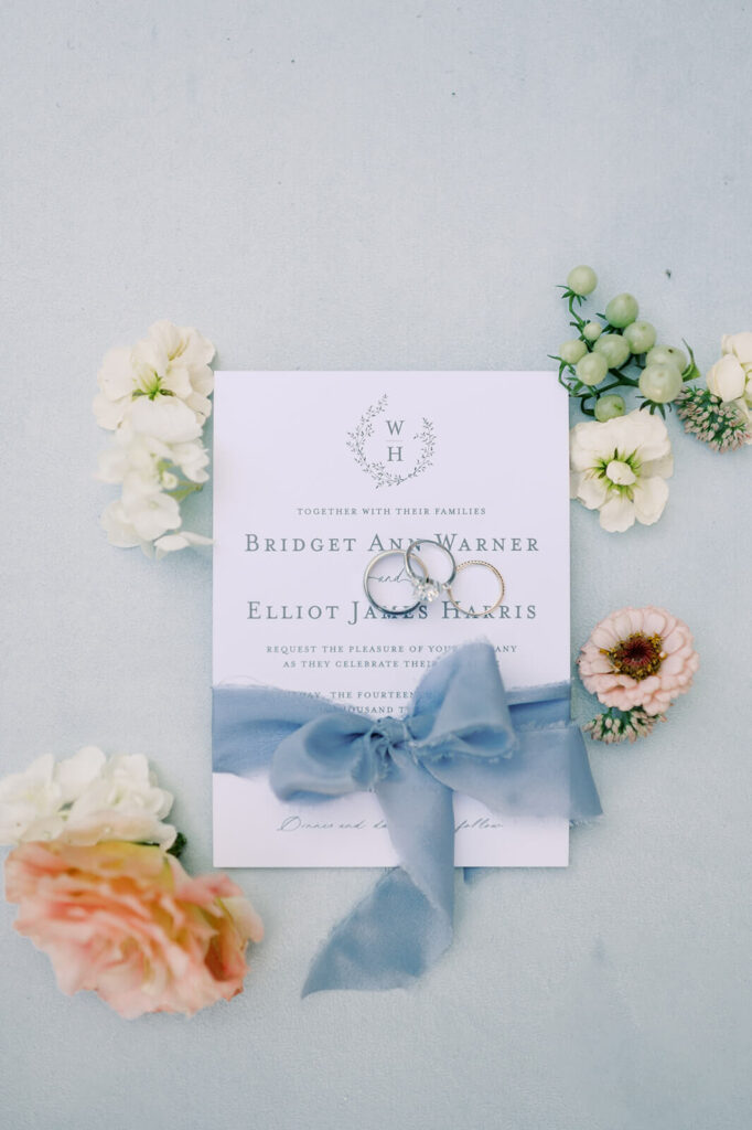 Romantic wedding invitation with blue ribbon