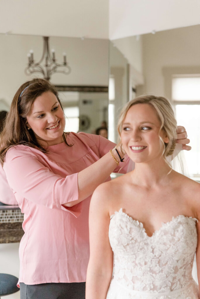 Lauren Cross helping a bride