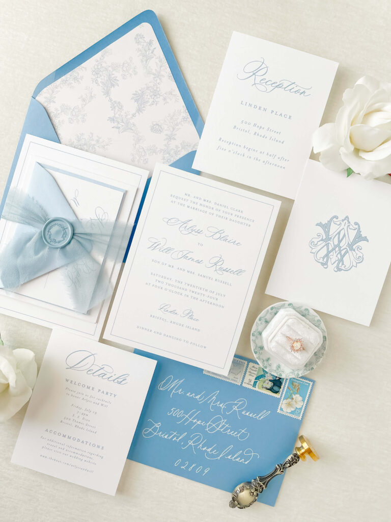 Romantic wedding invitation suite featuring delicate floral envelope liner