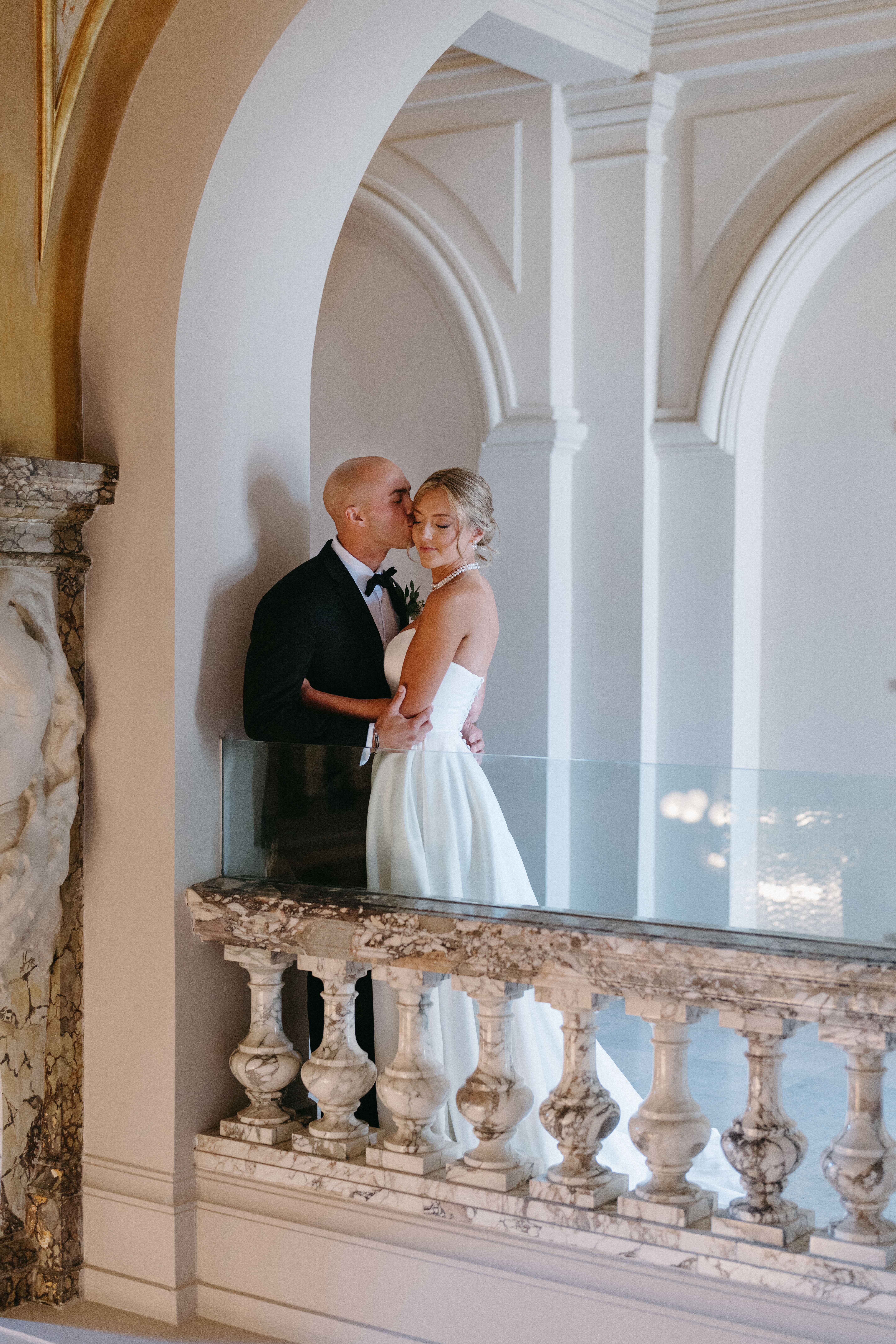 Bride and groom embracing in Elstowe Manor at Elkins Estate