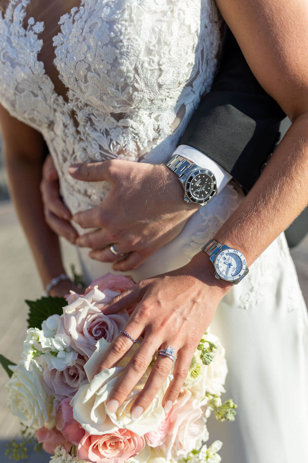 Bride and groom detail shot with rings