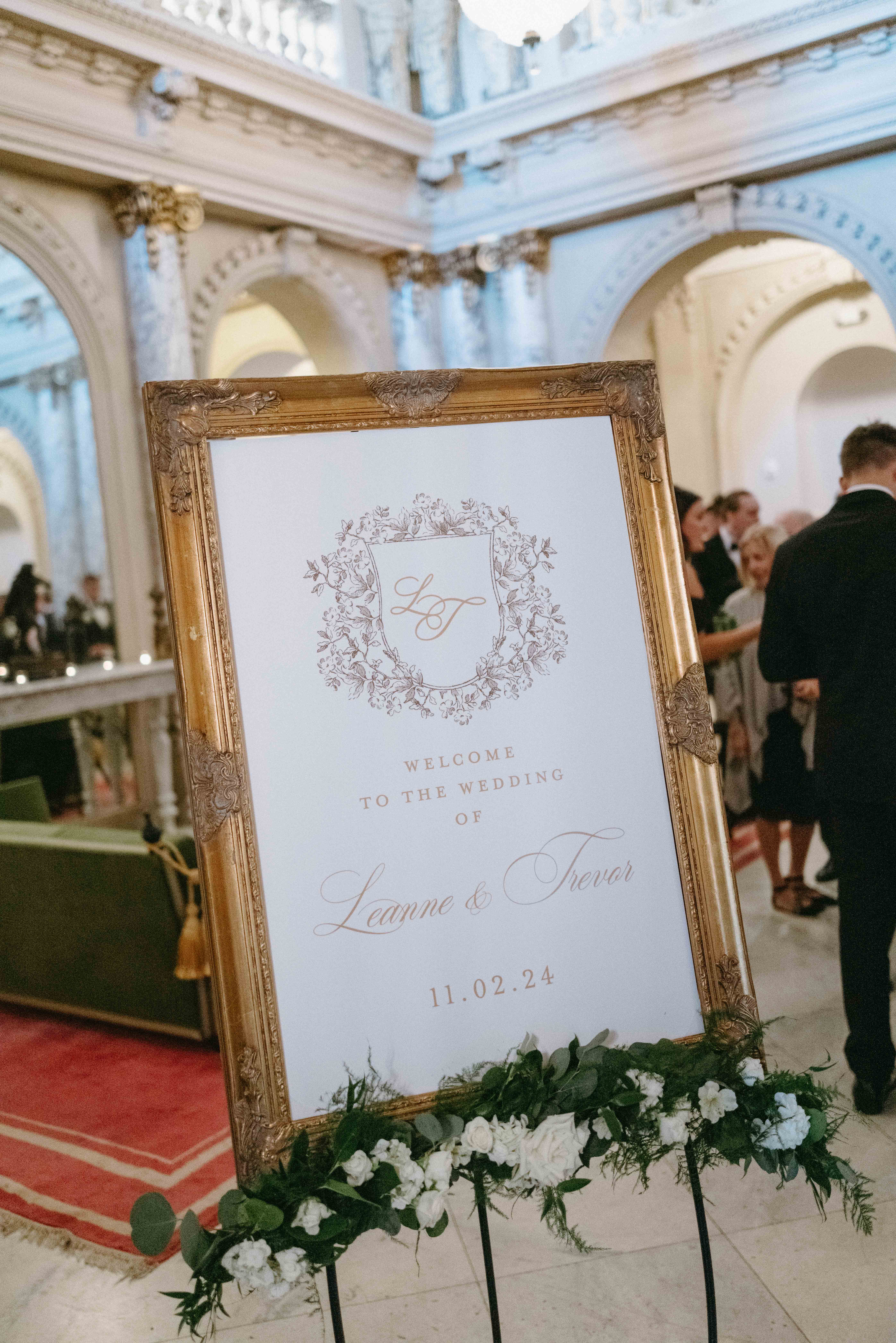 Elegant wedding reception sign in an ornate gold frame
