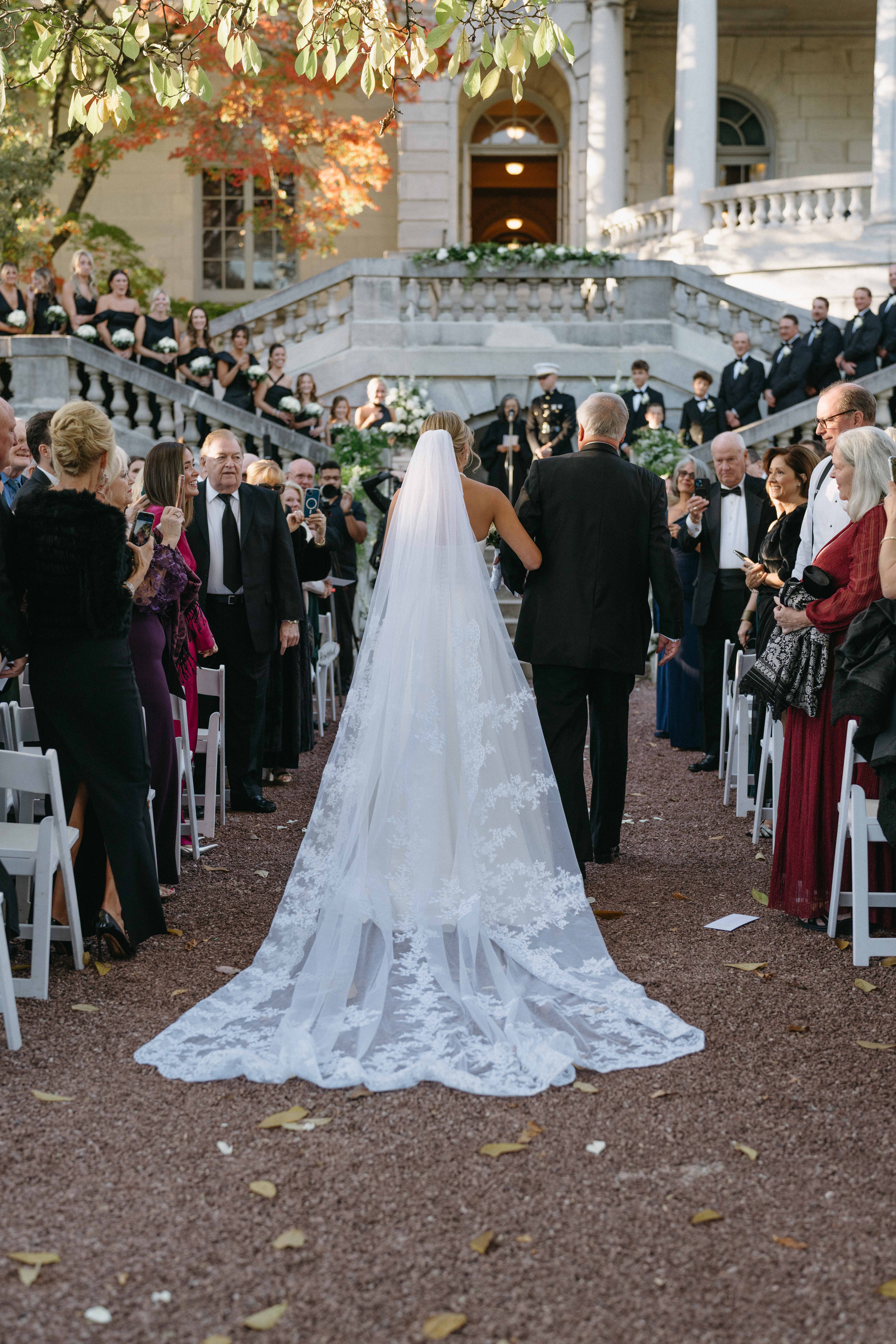 Bride walking down aisle with her father