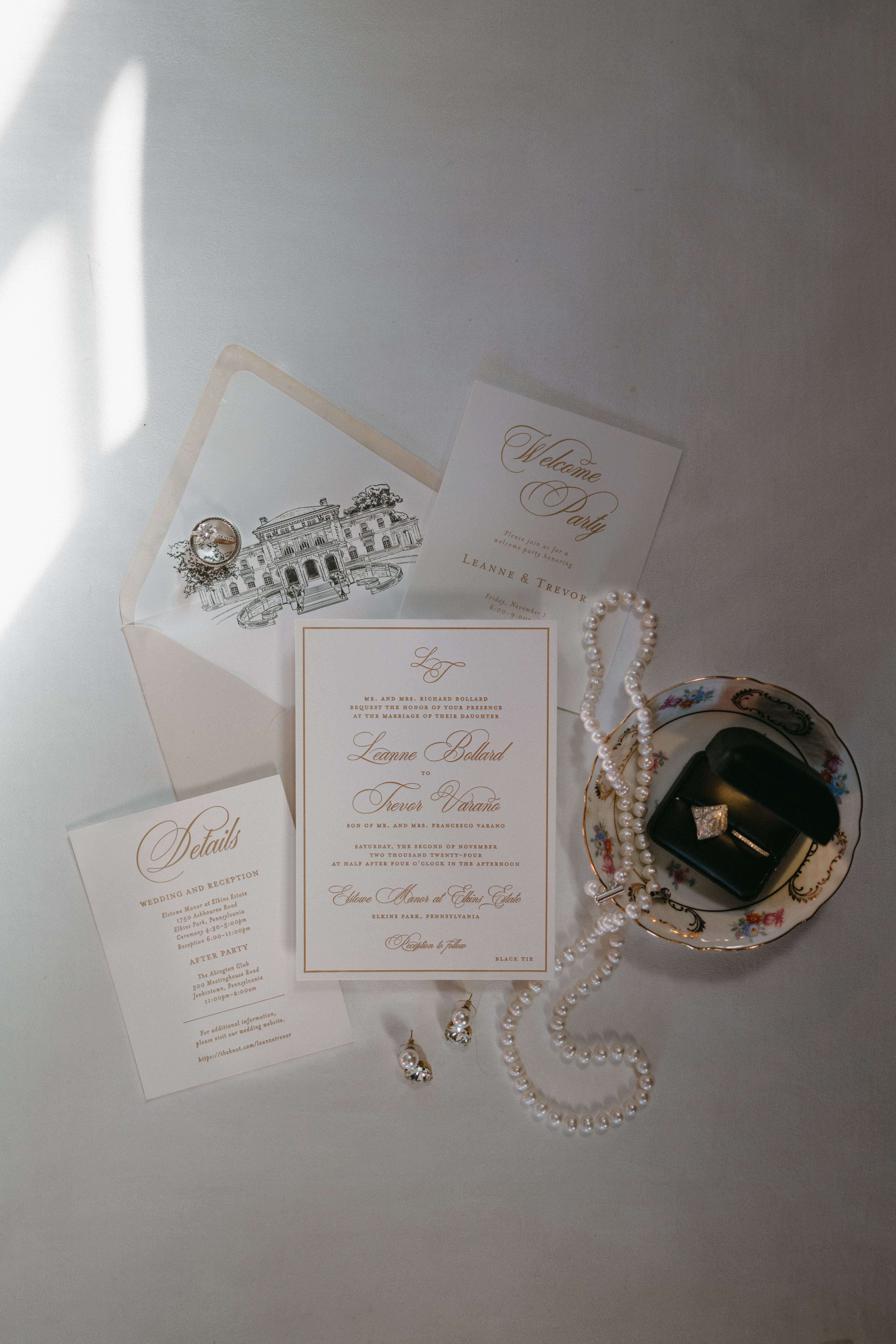 Timeless letterpress wedding invitation suite with wedding rings and bridal jewelry
