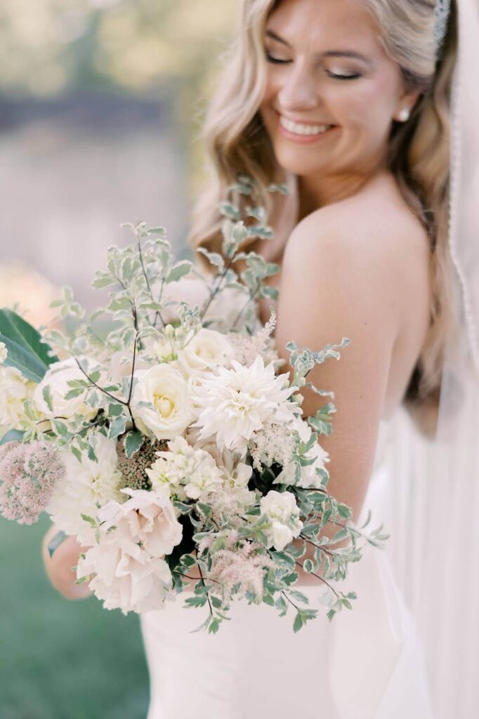 Bride with bouquet in spring wedding colors