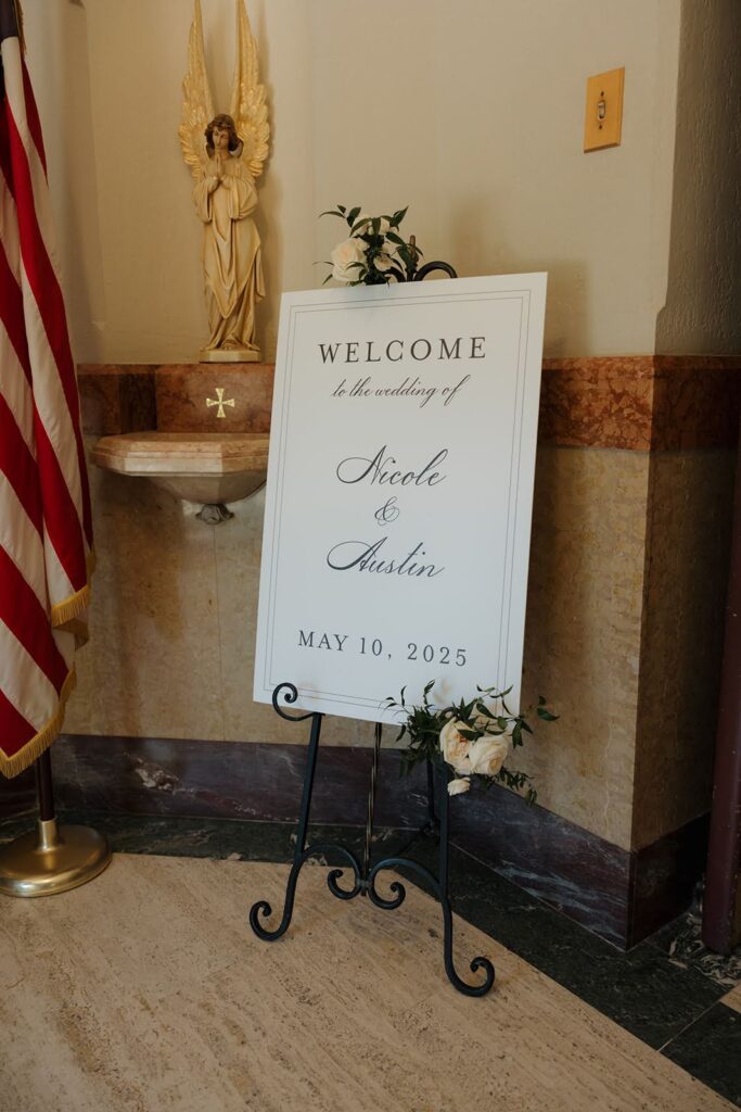 Elegant wedding ceremony welcome sign that says "Welcome to the wedding of Nicole and Austin, May 10, 2025"