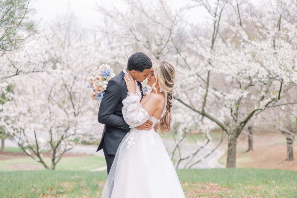 Bride and groom embracing at Overhills Mansion wedding venue