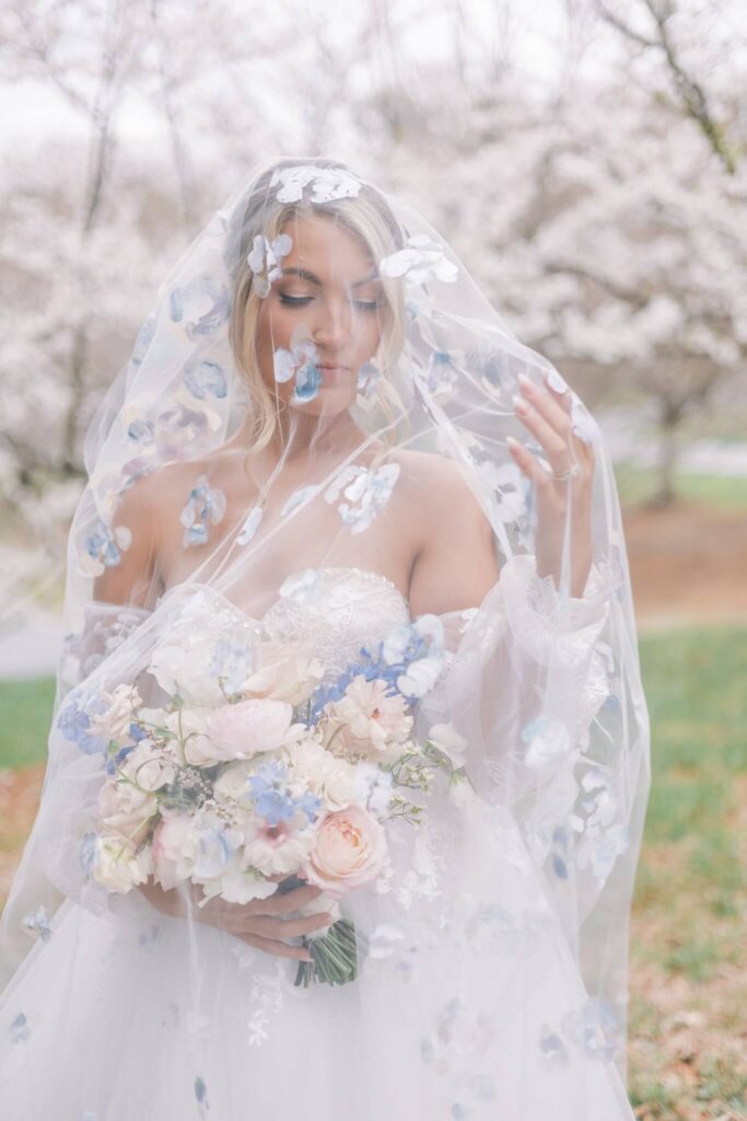 Bride wearing hand-painted floral wedding veil