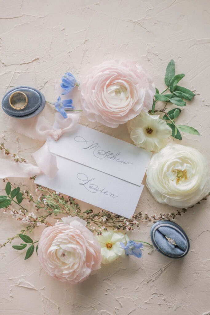 Romantic calligraphed place cards with
pink silk ribbon