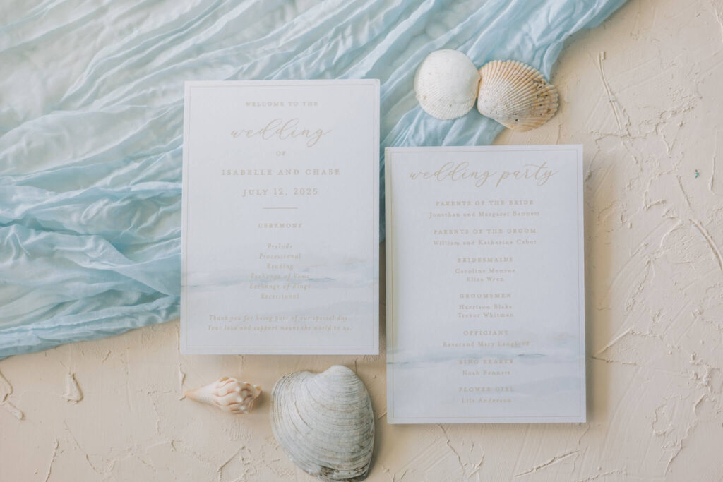 Two-sided wedding ceremony program featuring watercolor coastal art
