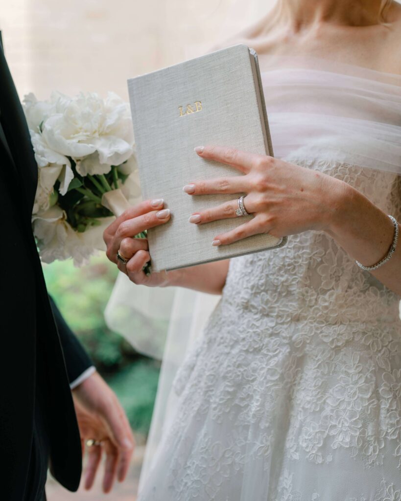 Bride with monogrammed private vow journal