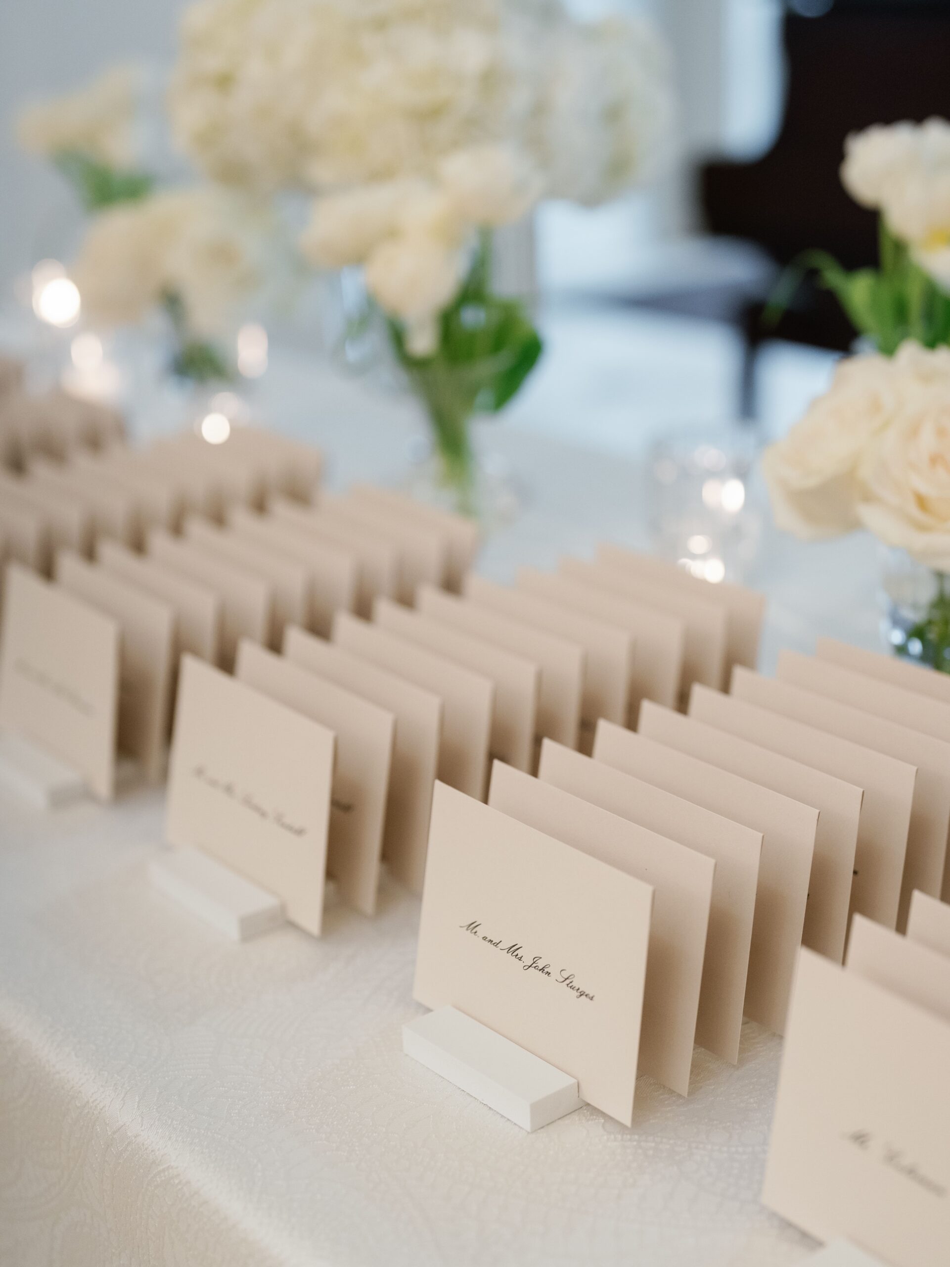 Escort display of small envelopes with guest names in script