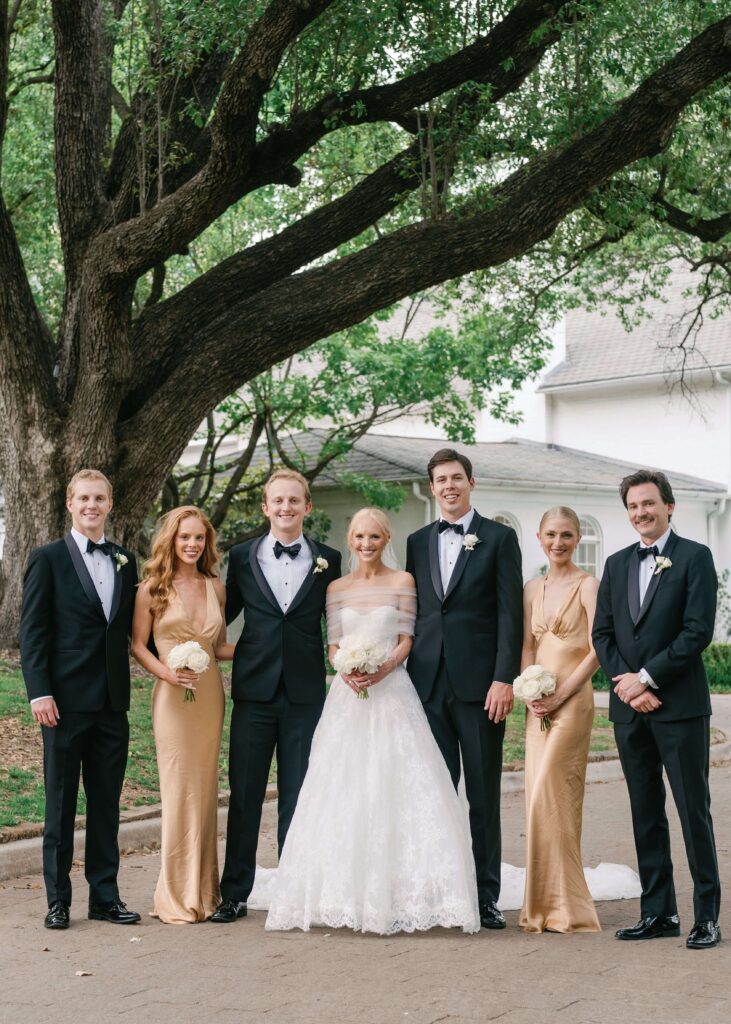 Wedding party posing with bride and groom
