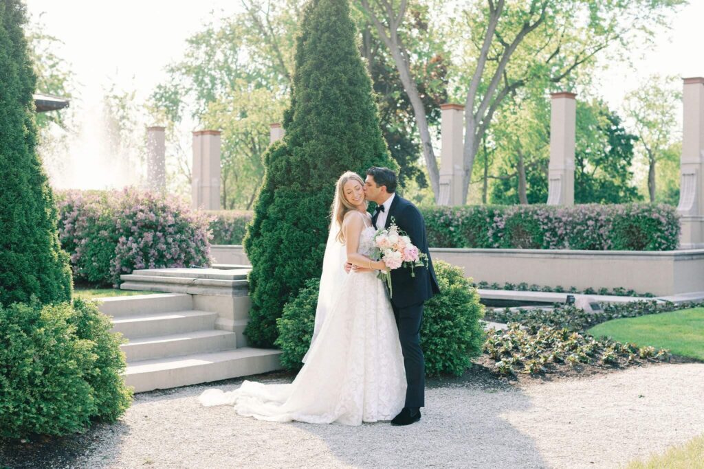 Bride and groom kissing at their spring wedding