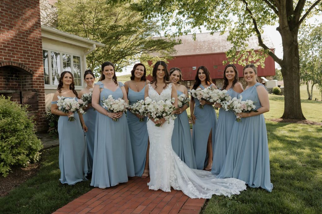 Bridal party smiling with bride at The Farm at Eagles Ridge