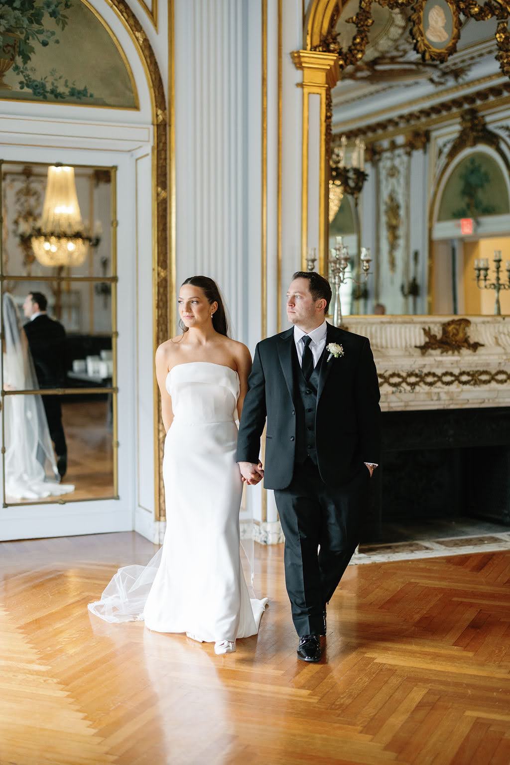 Bride and groom in ornate, gilded room in Elkins Estate