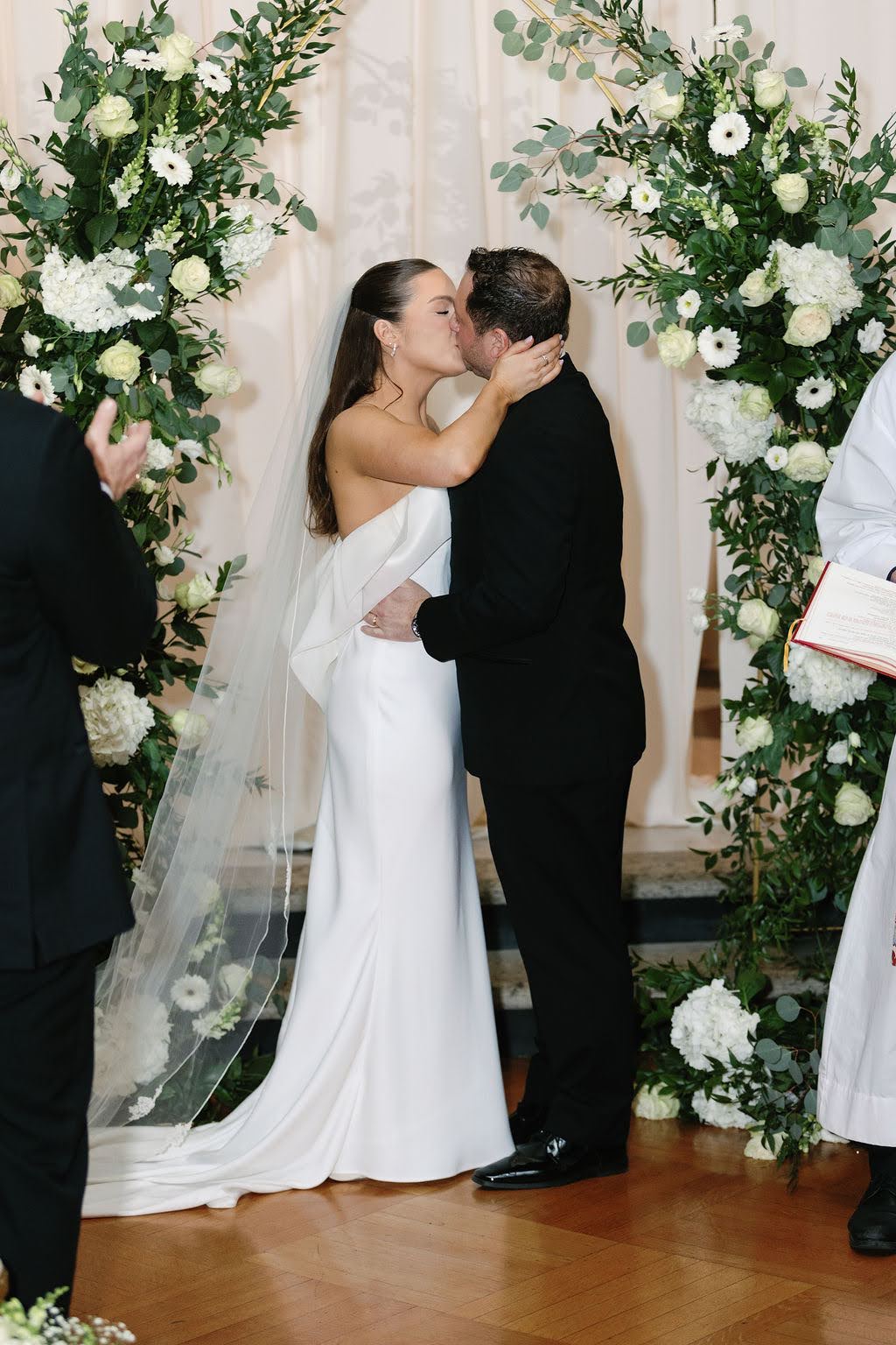 Bride and groom share their first kiss after the Elkins Estate wedding ceremony
