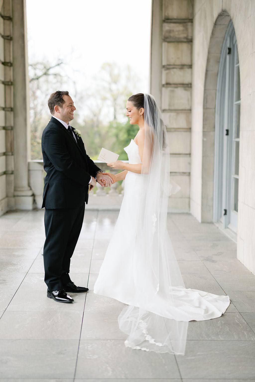 Bride and groom read vows during their first look