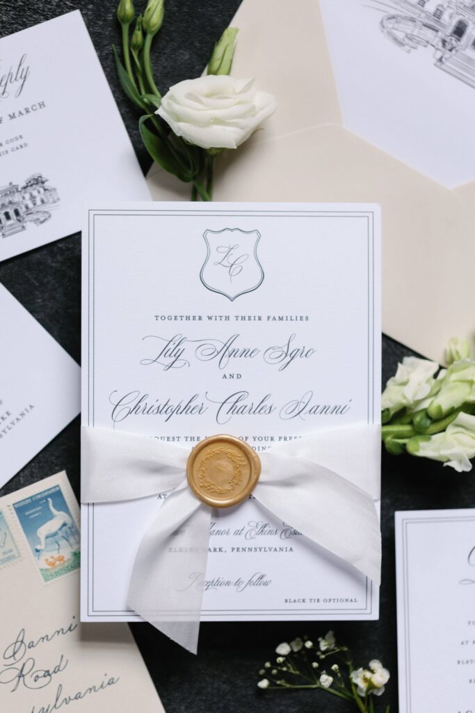 Timeless Elkins Estate wedding invitation with elegant script font, monogram, and gold wax seal