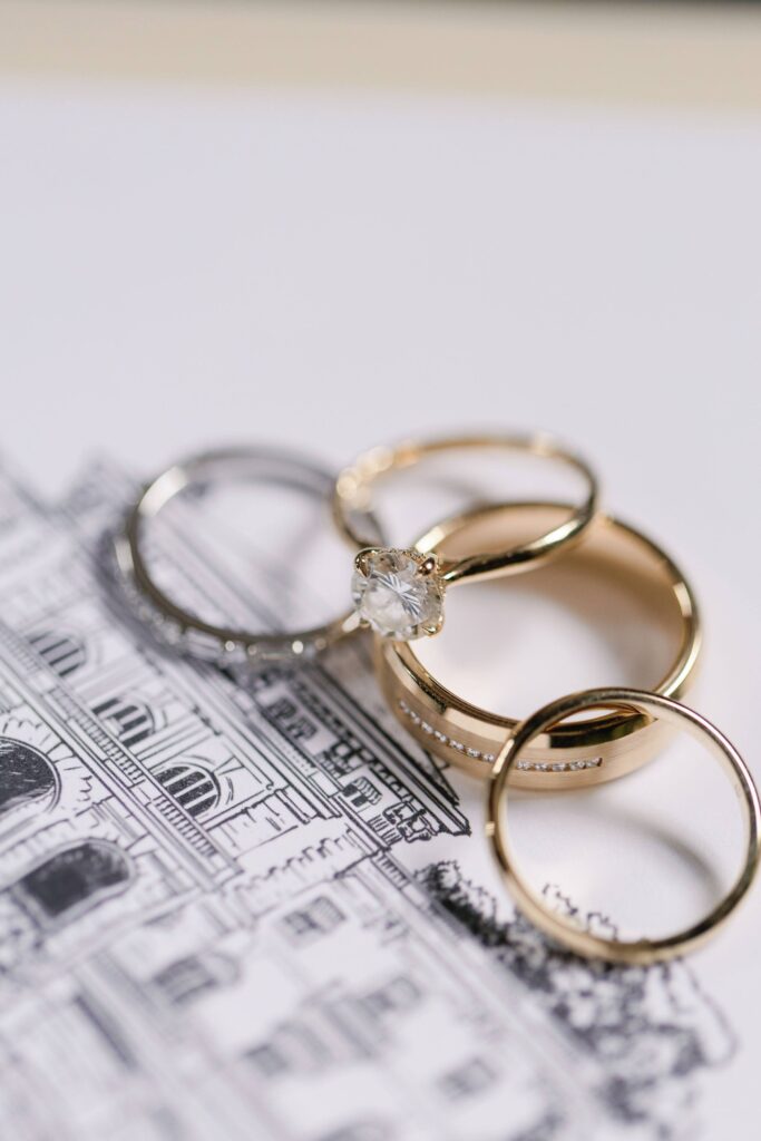 Wedding rings resting on envelope liner venue illustration