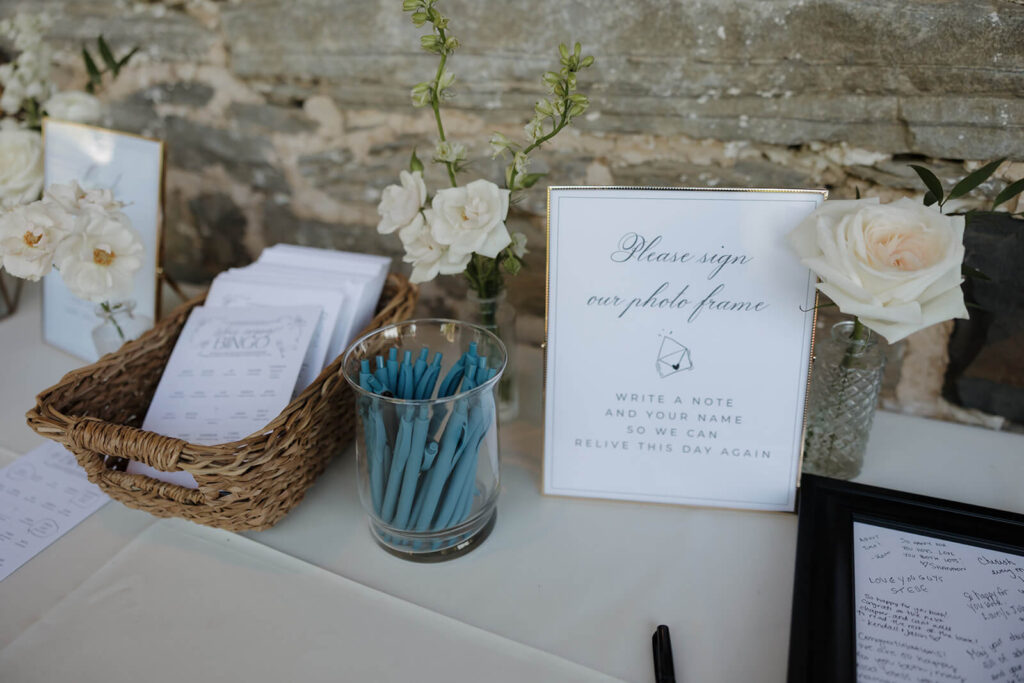 Elegant guestbook sign in a gold photo frame