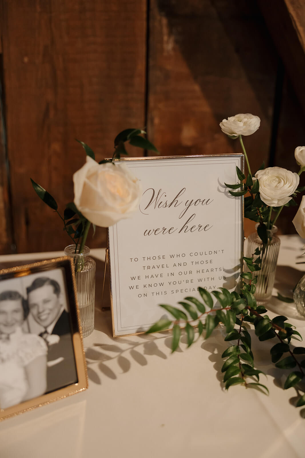 Elegant remembrance sign in a gold photo frame with photos of loved ones