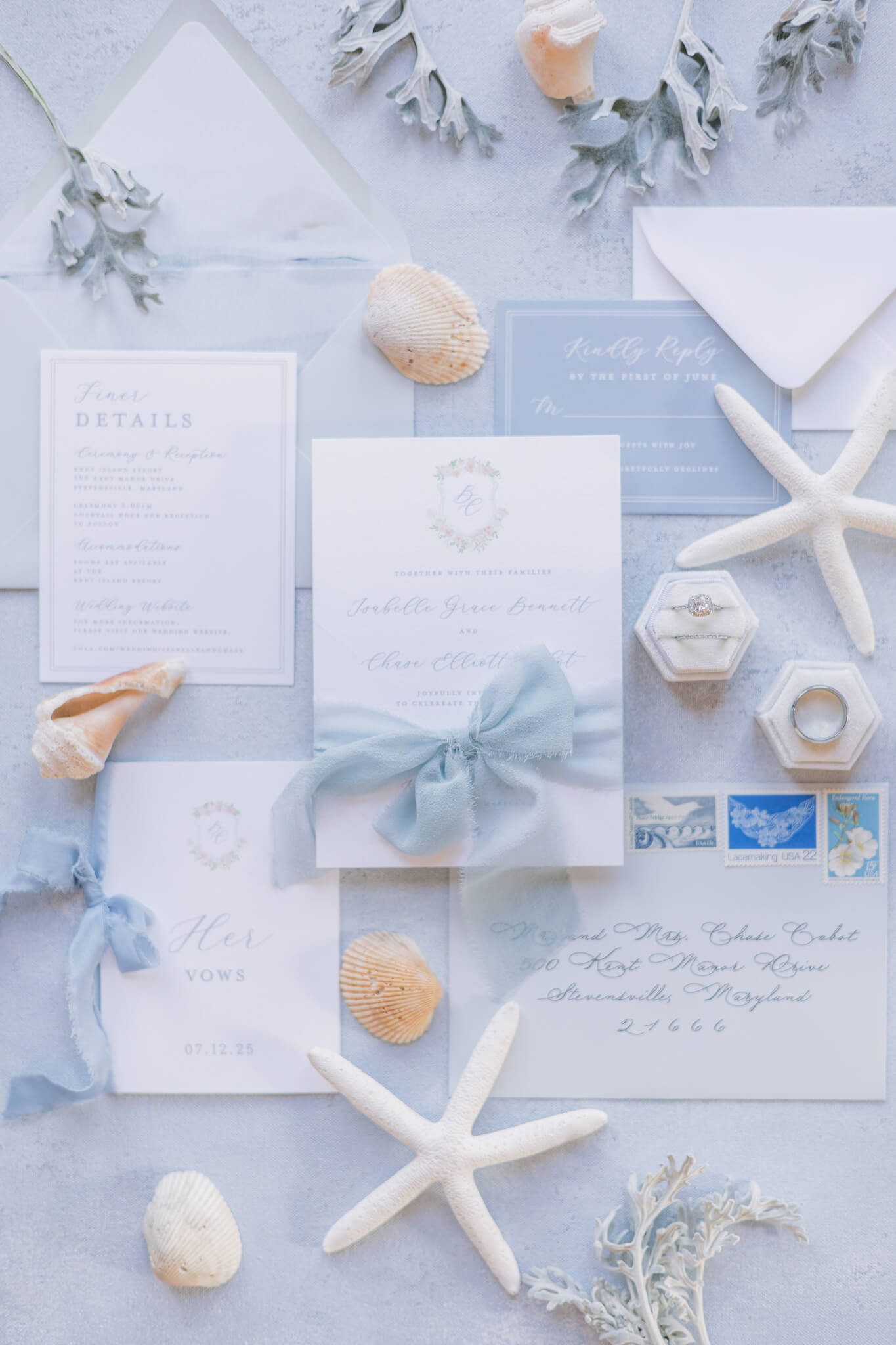 Light blue wedding invitation suite with silk ribbon, ocean art envelope liner, and custom floral watercolor monogram