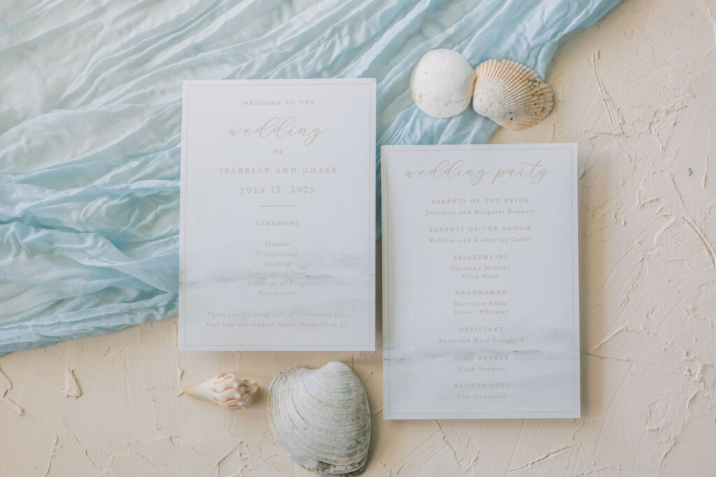 Coastal wedding program with watercolor ocean artwork