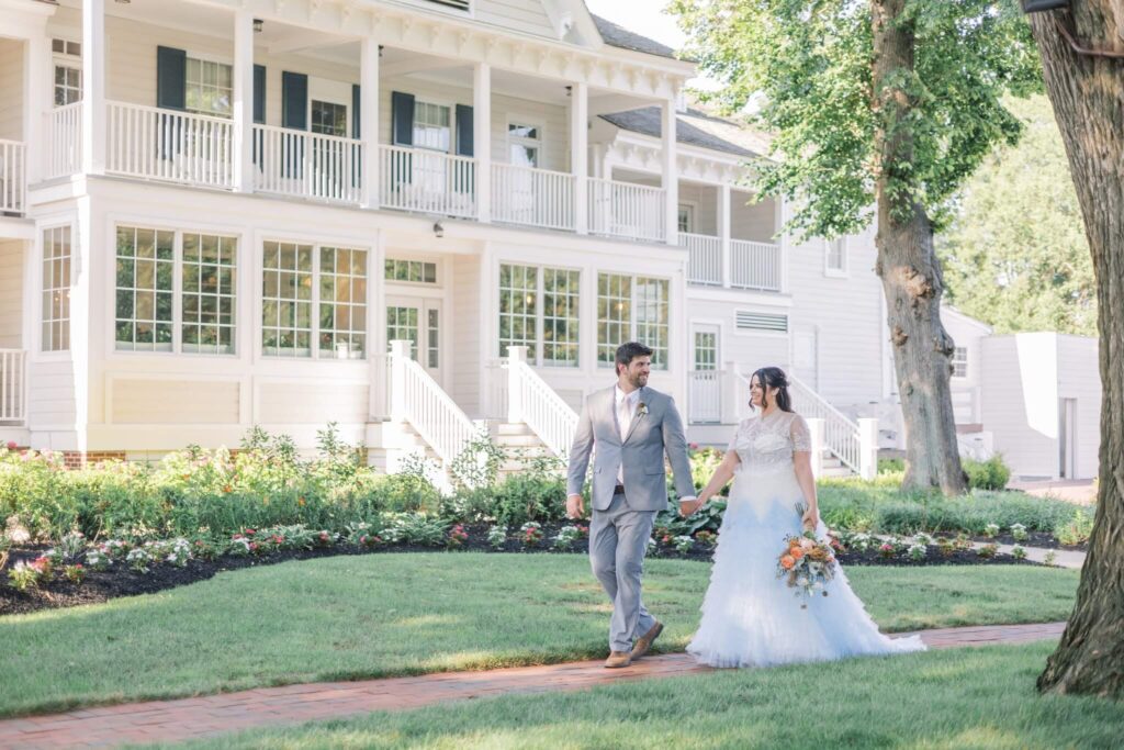 Married couple stroll the grounds of Kent Island Resort