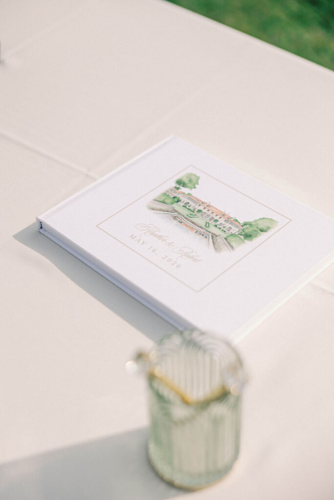Custom wedding guestbook with a watercolor venue illustration