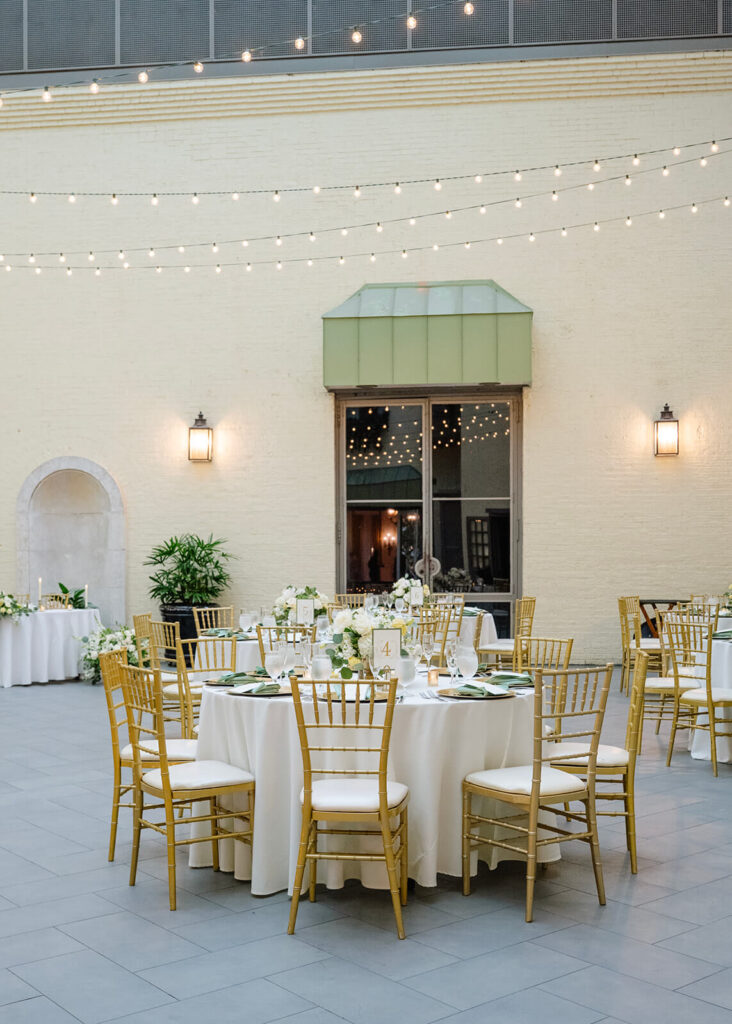 White and gold wedding reception table at the Engineers Club in Baltimore, Maryland