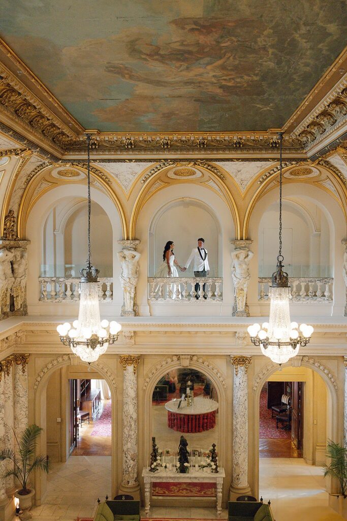 Bride and groom walking through the elegant halls at Elkins Estate
