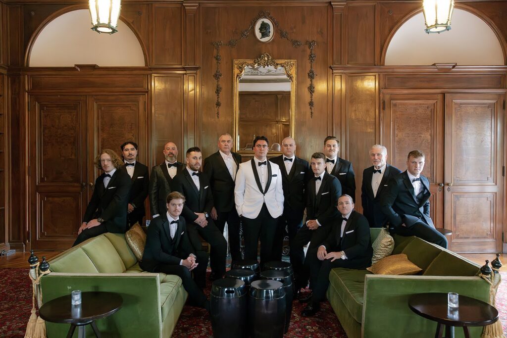 Groom with groomsmen in a lounge at Elkins Estate