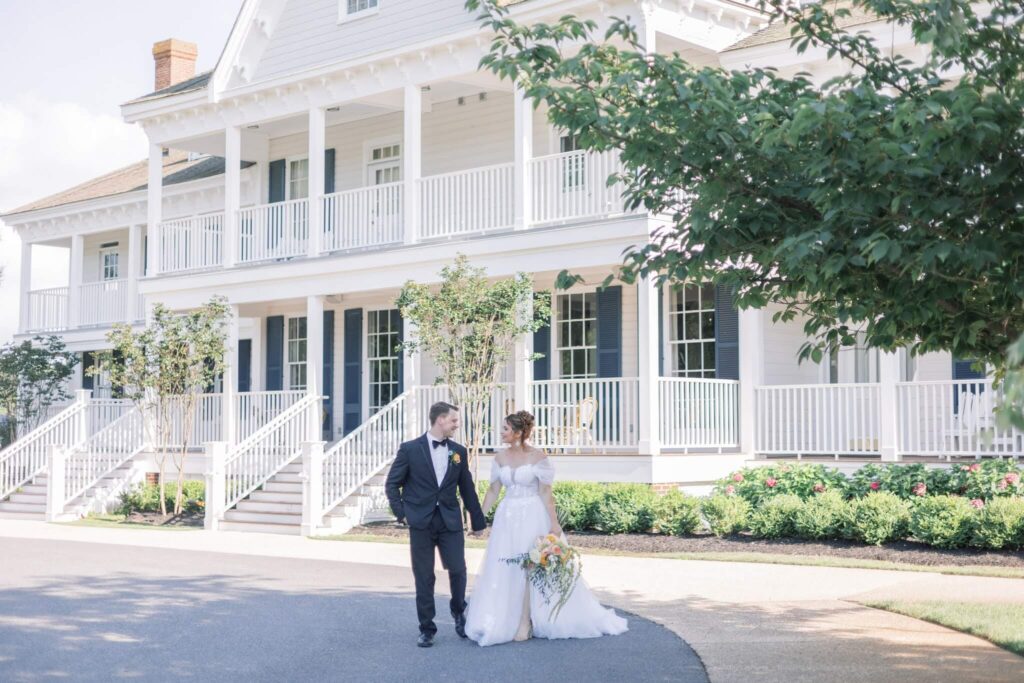 Bride and groom walk hand in hand at their wedding at East Coast wedding venue Kent Island Resort