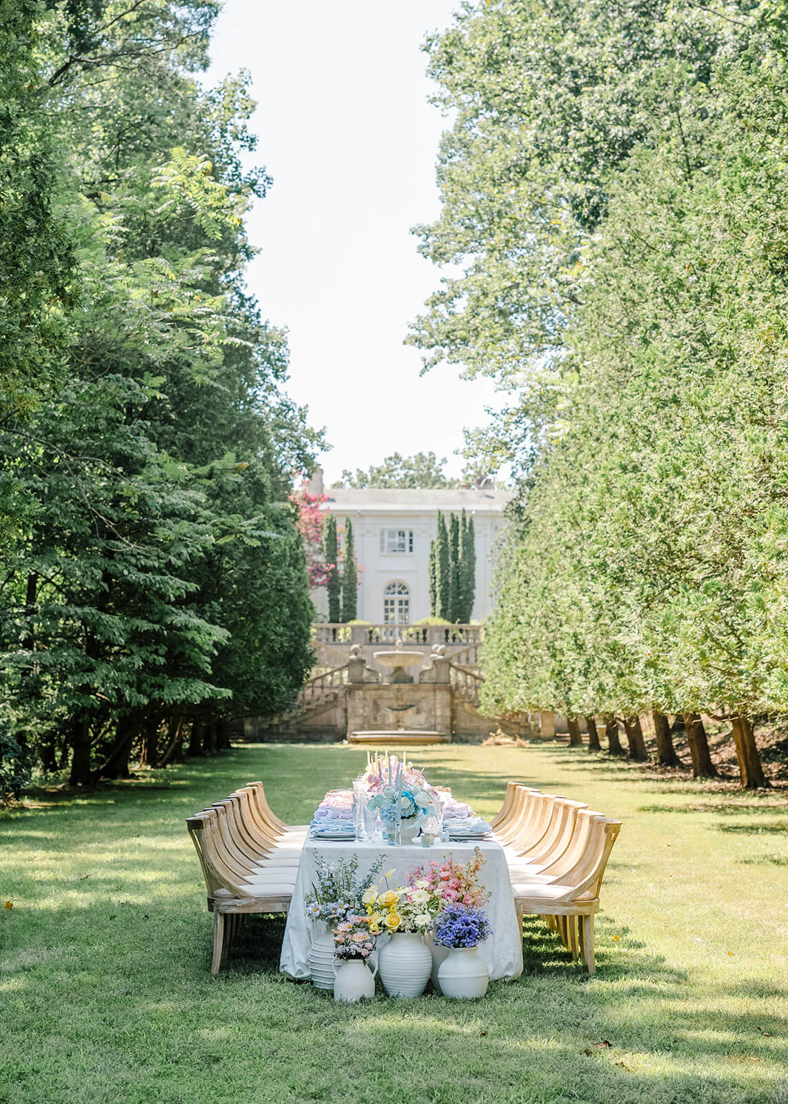 Colorful outdoor wedding reception table on the lawn of Strong Mansion, an East Coast wedding venue in Maryland