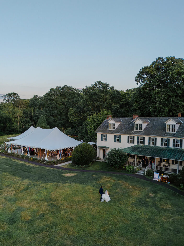 Exterior view of Spring Manor House, including a tented wedding reception