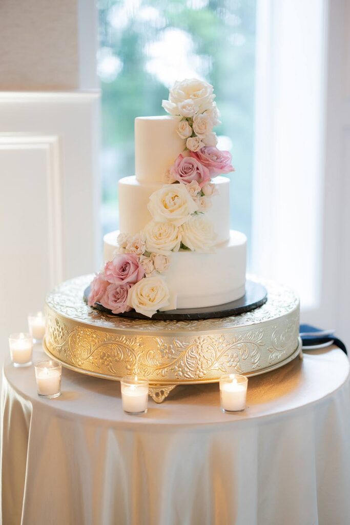 Elegant three-tiered wedding cake with roses