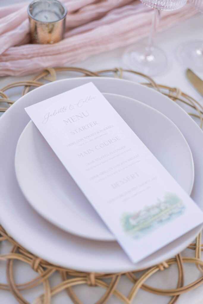 Wedding menu card featuring a watercolor venue illustration of Kent Island Resort
