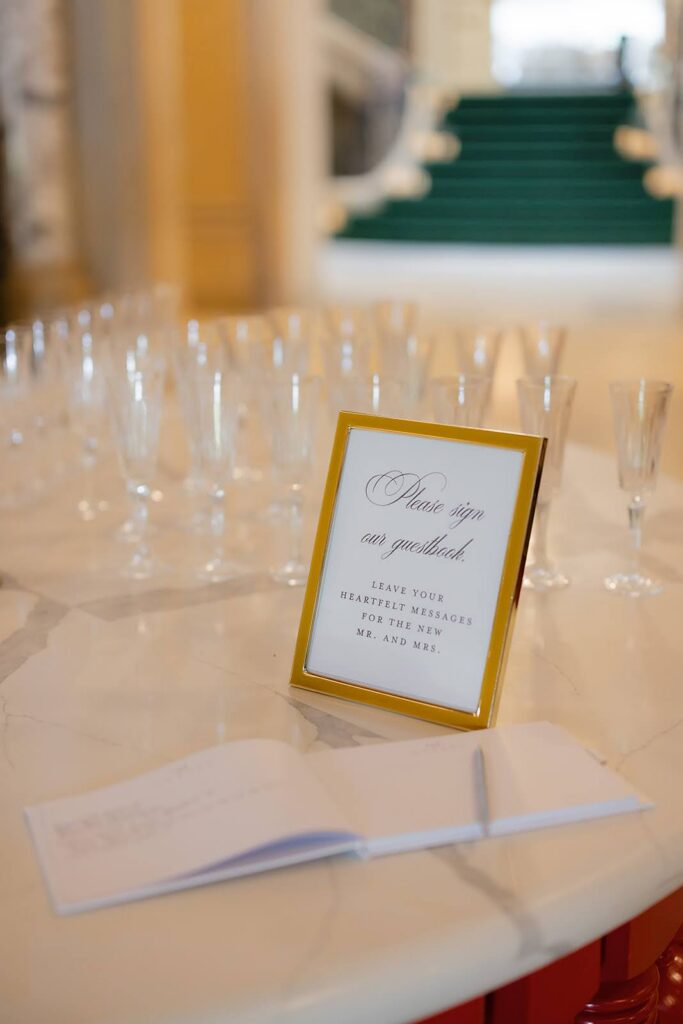 Guestbook sign directing guests to sign the wedding guestbook