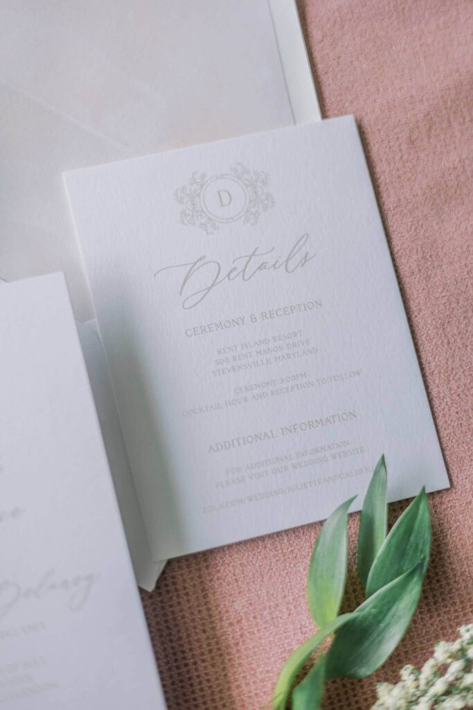 Wedding invitation details card with custom floral monogram