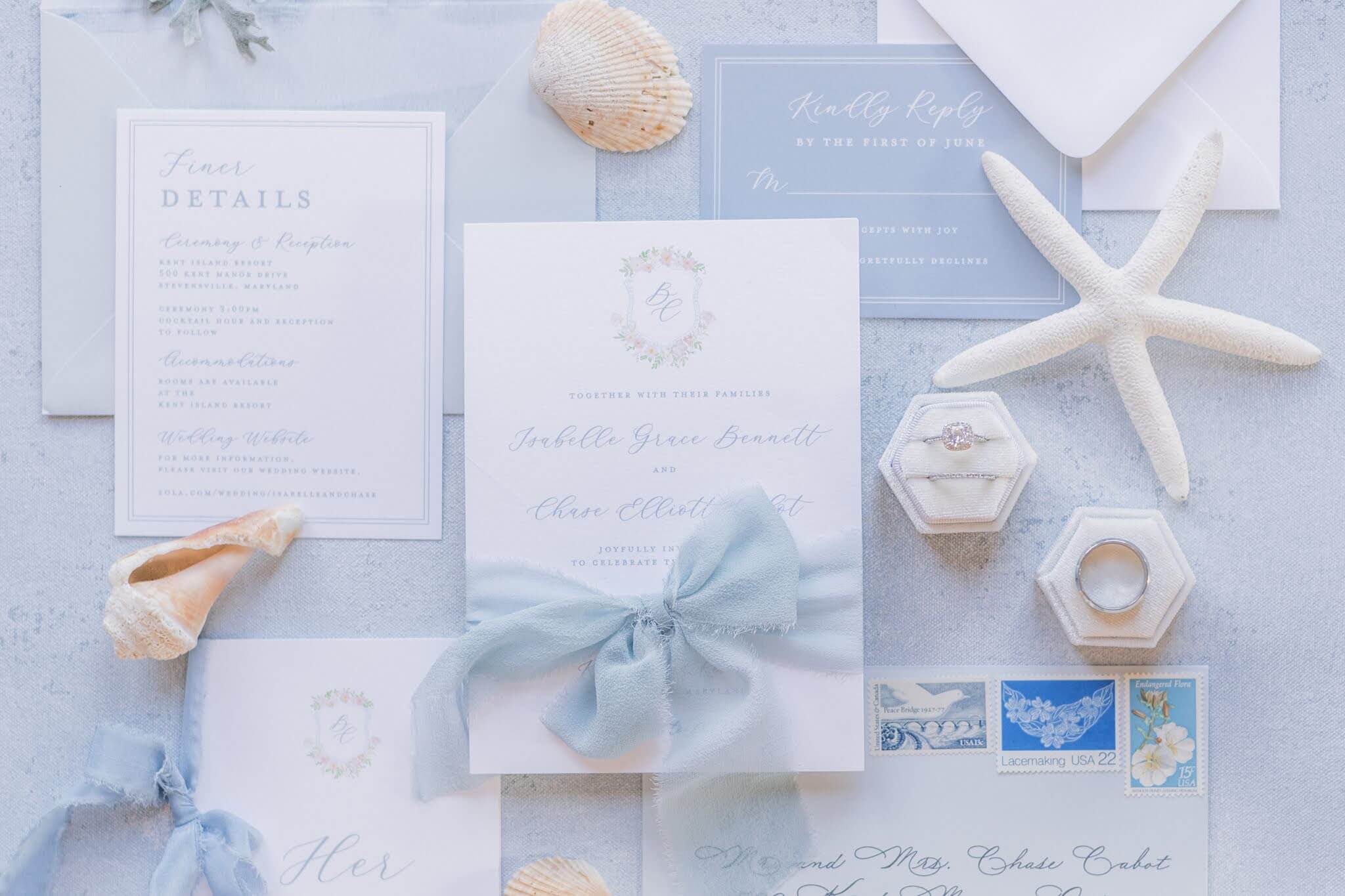 Romantic coastal inspired wedding invitation suite in soft shades of blue and custom monogram and crest