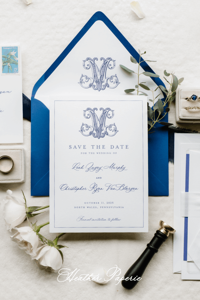 Elegant blue and white save the date card with a custom monogram