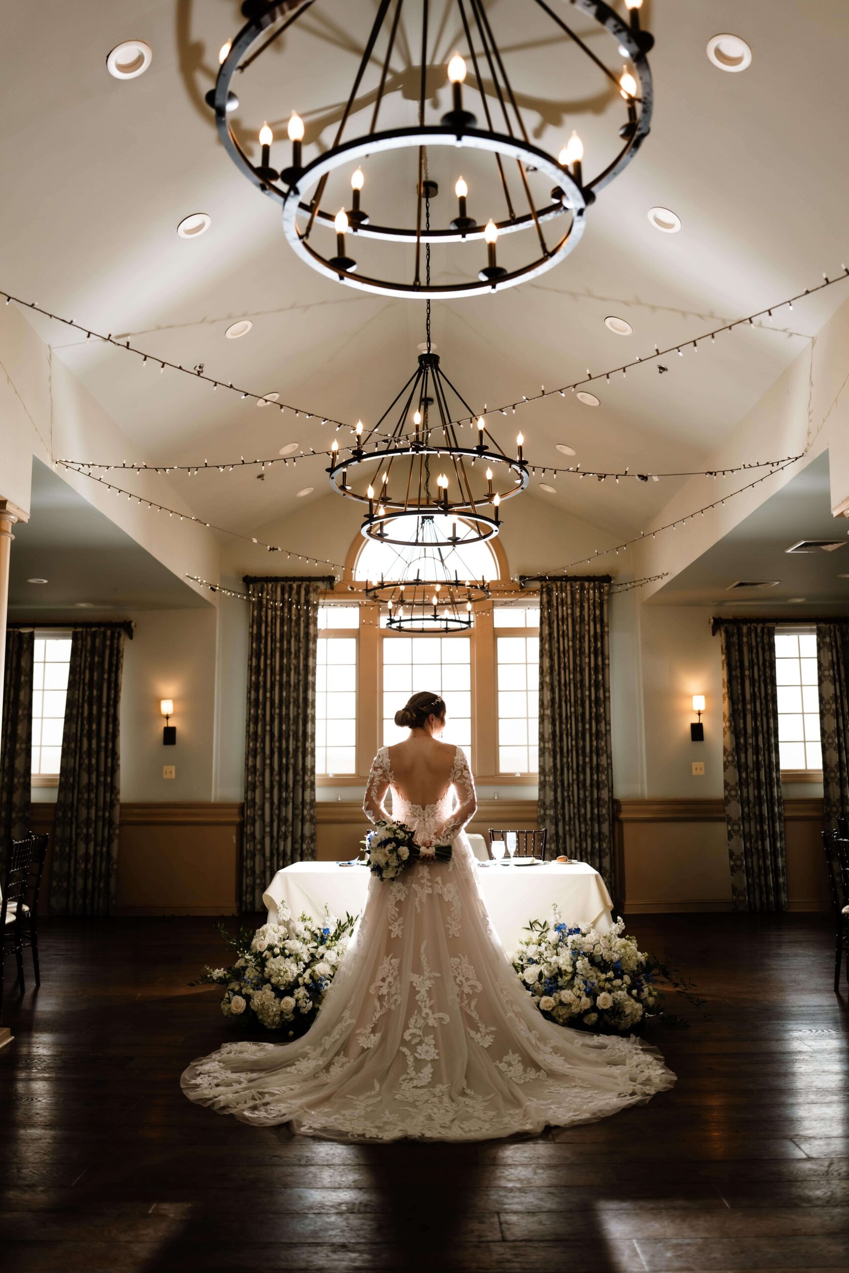 Bridal portrait showcasing the back of the bride's dress on her wedding day at Joseph Ambler Inn