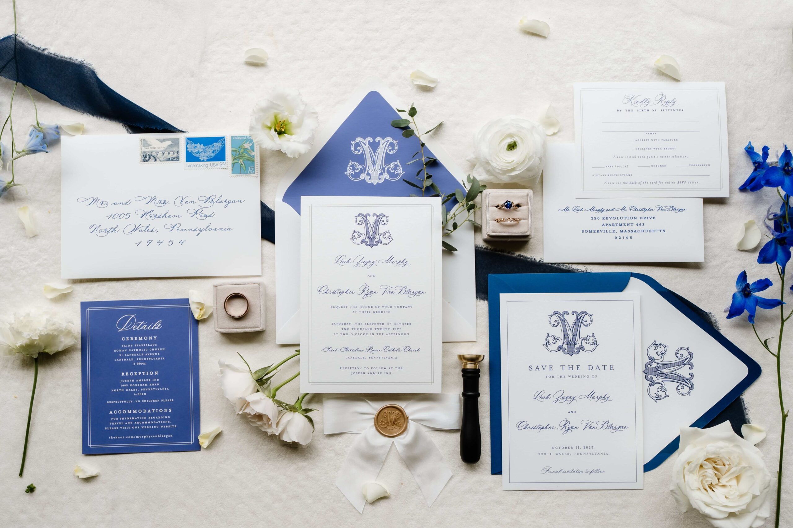 Elegant and timeless wedding invitation suite in ivory and sapphire blue with a custom monogram and gold wax seal