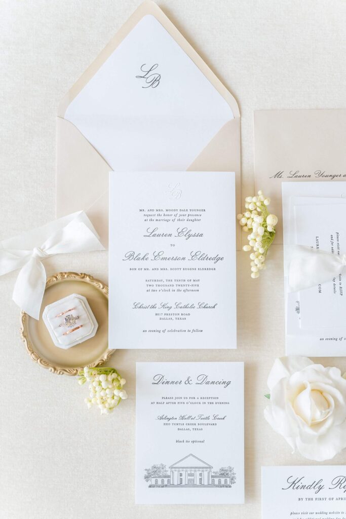 Formal wedding invitation suite in black and white letterpress printing with a venue illustration and custom monogram