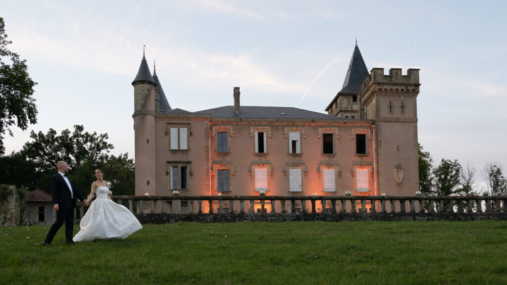 Bride and groom walking outside Château de Sibra